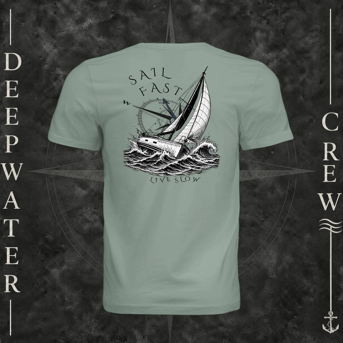 Sage Deepwater Crew Co. Fast & Free crewneck T-shirt, back view with large sailboat, ocean wave and compass graphic featuring “Sail Fast Live Slow” lettering.