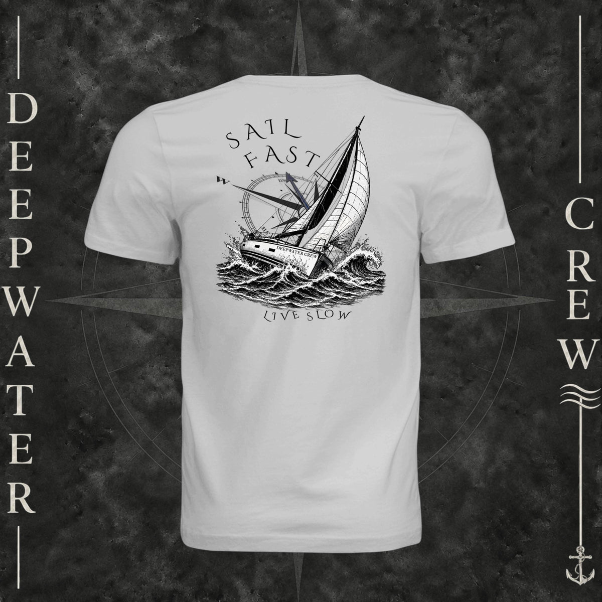 Silver Deepwater Crew Co. Fast & Free crewneck T-shirt, back view with large sailboat, ocean wave and compass graphic featuring “Sail Fast Live Slow” lettering.