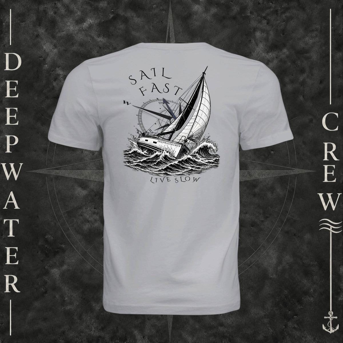 Solid Athletic Grey Deepwater Crew Co. Fast & Free crewneck T-shirt, back view with large sailboat, ocean wave and compass graphic featuring “Sail Fast Live Slow” lettering.