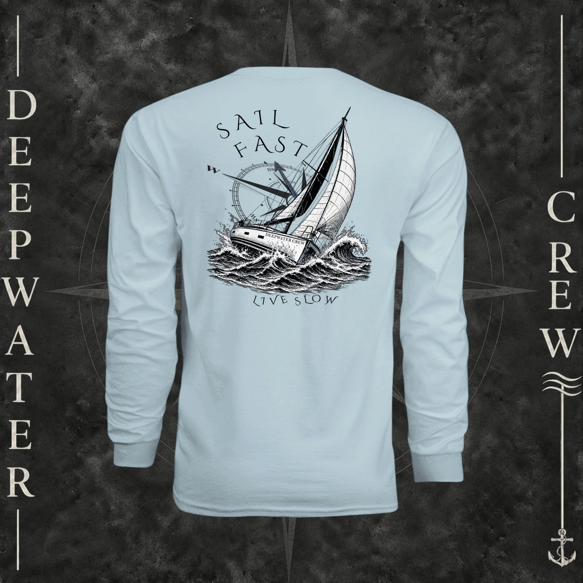 Pastel Blue Deepwater Crew Co. Fast & Free UPF 44+ long-sleeve performance shirt, back view with large sailboat, ocean wave and compass graphic featuring “Sail Fast Live Slow” lettering.