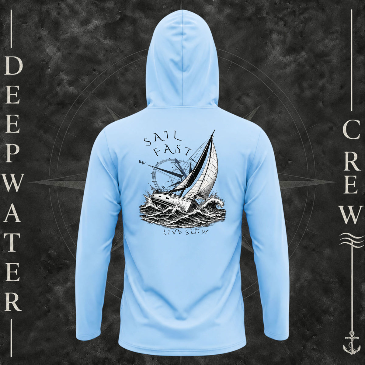 Blue Mist Deepwater Crew Co. Fast & Free UPF 50+ performance hoodie, back view with large sailboat, ocean wave and compass graphic featuring “Sail Fast Live Slow” lettering.