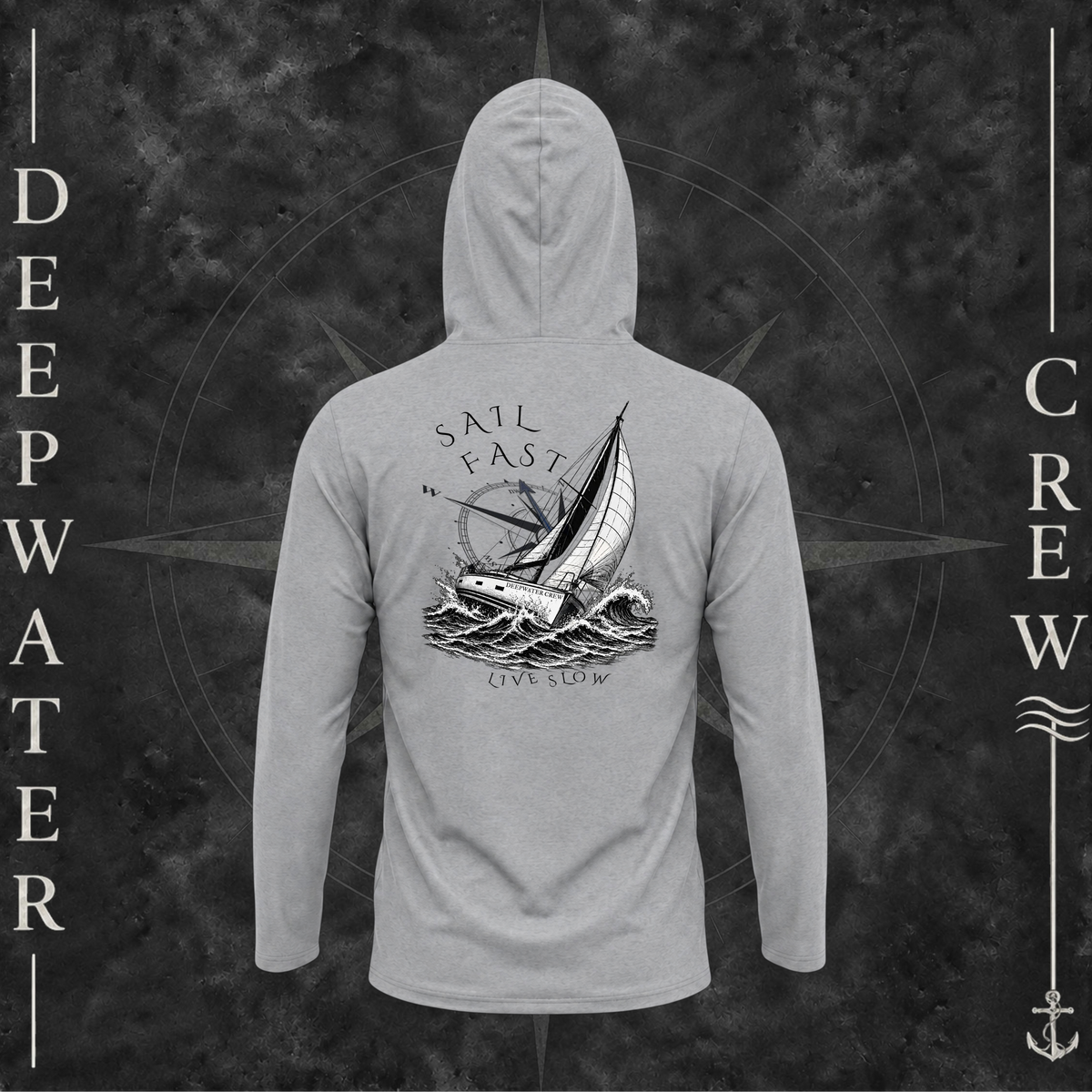 Medium Grey Deepwater Crew Co. Fast & Free UPF 50+ performance hoodie, back view with large sailboat, ocean wave and compass graphic featuring “Sail Fast Live Slow” lettering.