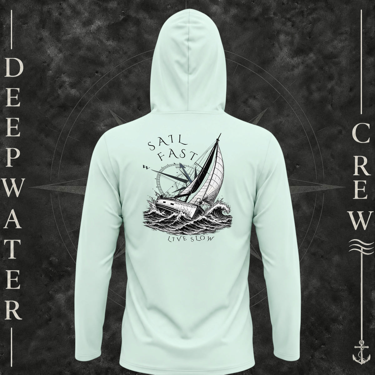 Mint Green Deepwater Crew Co. Fast & Free UPF 50+ performance hoodie, back view with large sailboat, ocean wave and compass graphic featuring “Sail Fast Live Slow” lettering.