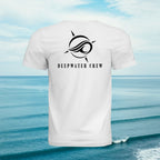 White Deepwater Crew Co. Flagship crewneck T-shirt, back view with large compass-and-wave logo and Deepwater Crew lettering, against an ocean background.