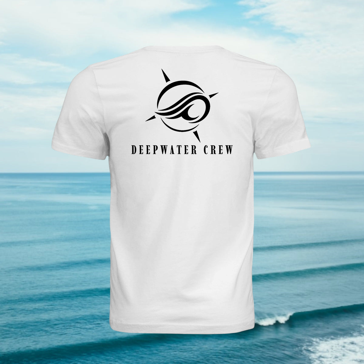 White Deepwater Crew Co. Flagship crewneck T-shirt, back view with large compass-and-wave logo and Deepwater Crew lettering, against an ocean background.