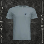 Blue Storm Deepwater Crew Co. Forged of Salt crewneck T-shirt, front view with small blue-outlined DC compass-and-wave crest logo.