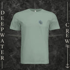 Sage Deepwater Crew Co. Forged of Salt crewneck T-shirt, front view with small blue-outlined DC compass-and-wave crest logo.