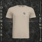 Tan Deepwater Crew Co. Forged of Salt crewneck T-shirt, front view with small blue-outlined DC compass-and-wave crest logo.