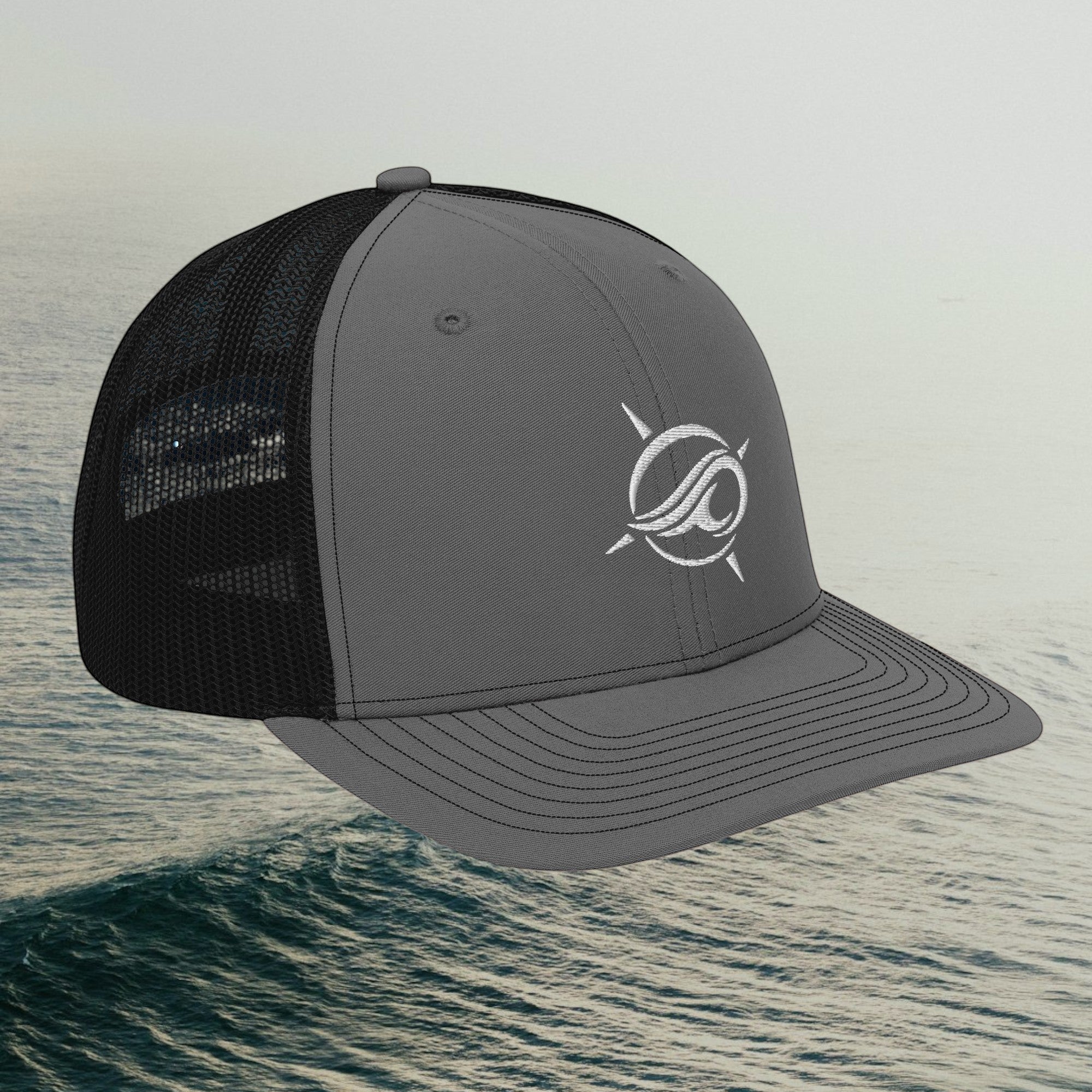 Deepwater Crew Co. grey and black trucker cap with embroidered wave logo, structured 6-panel design and mesh back.