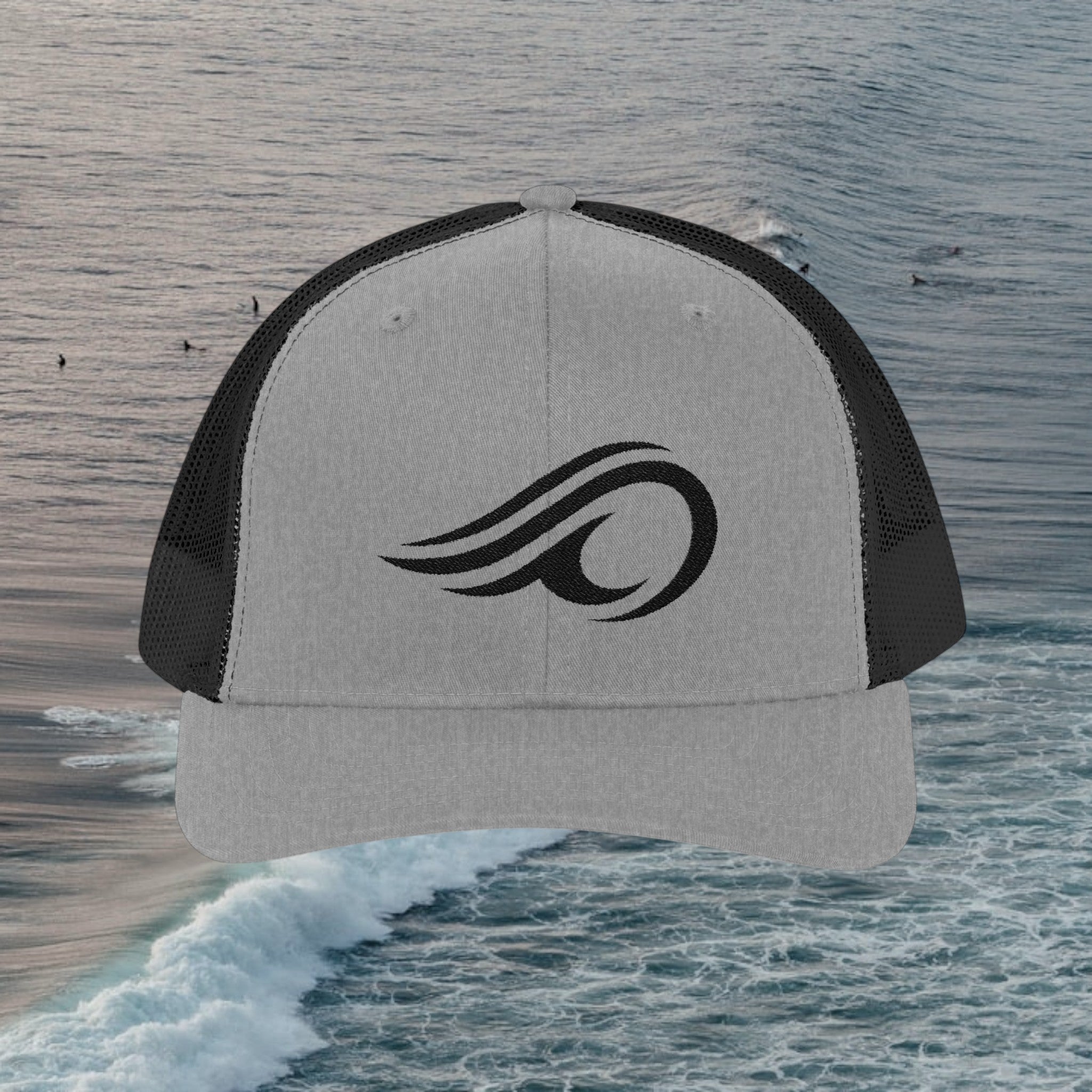 Deepwater Crew Co. grey and black trucker hat with embroidered wave logo. Cotton blend front, polyester mesh back.