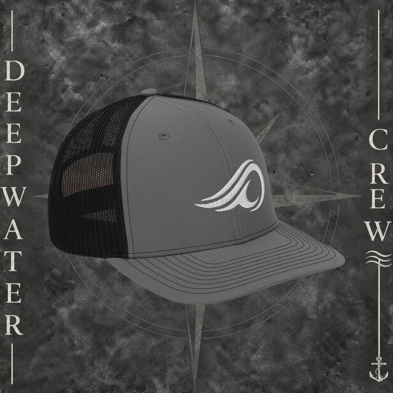 Deepwater Crew Co. gray and black Richardson 112 trucker hat with white embroidered wave logo, breathable mesh back, and structured six-panel design with snapback closure.