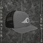 Deepwater Crew Co. gray and black Richardson 112 trucker hat with white embroidered wave logo, breathable mesh back, and structured six-panel design with snapback closure.