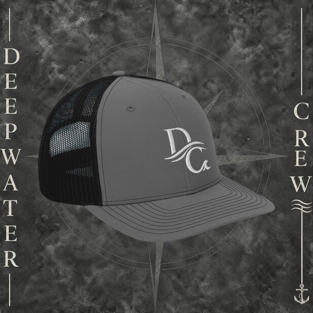 Deepwater Crew Co. grey and black trucker hat with embroidered wave logo on a water-themed background