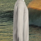 Deepwater Crew Co. light grey long sleeve hooded t-shirt with logo on sleeve against an ocean wave background