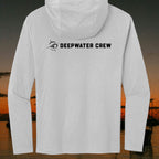 Deepwater Crew Co. light grey long sleeve tri-blend hoodie with black logo on the back against a sunset coastal view.