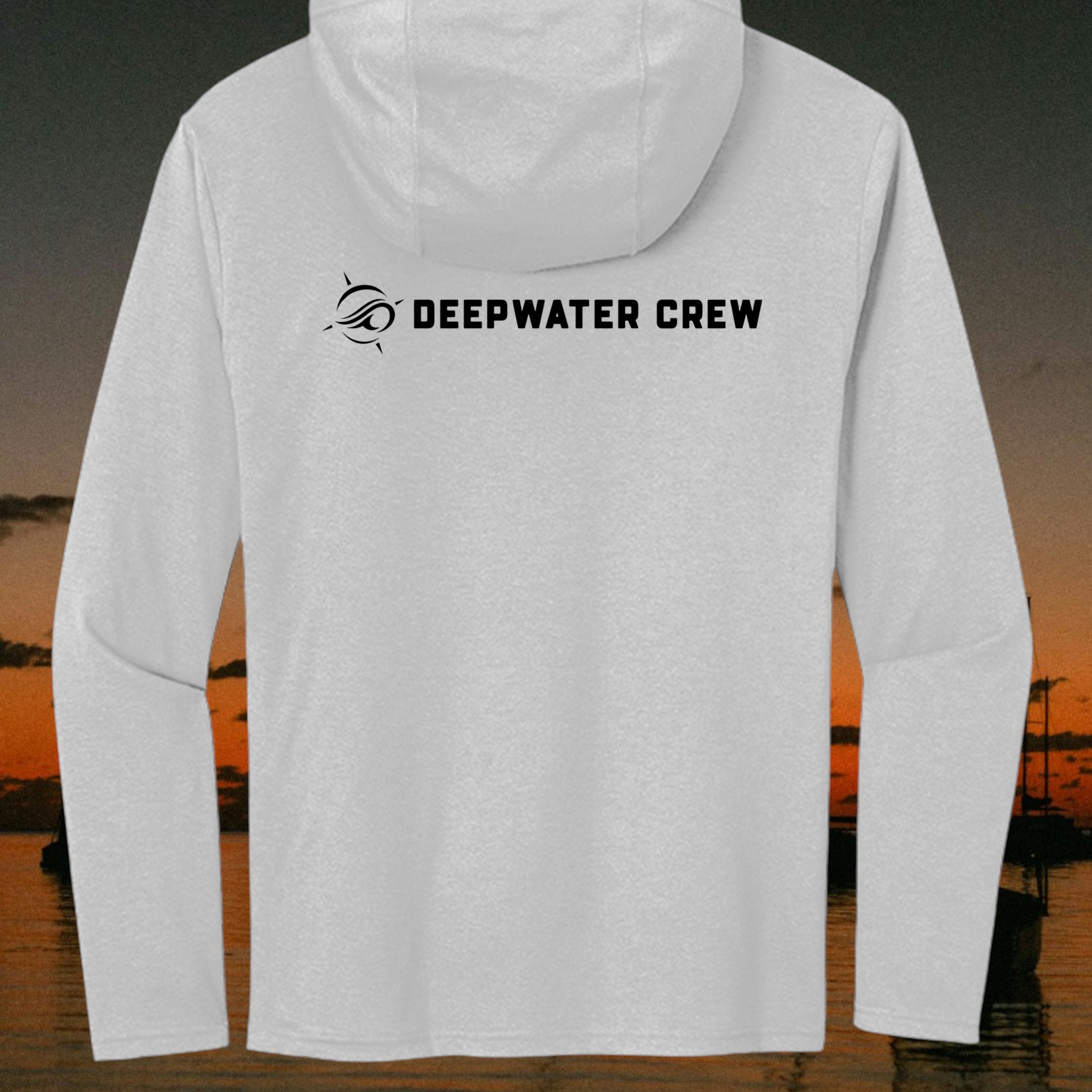 Deepwater Crew Co. light grey long sleeve tri-blend hoodie with black logo on the back against a sunset coastal view.