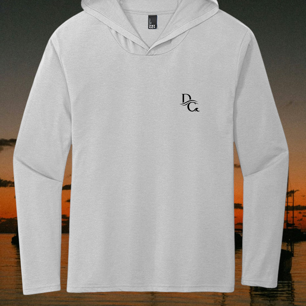 Deepwater Crew Co. light grey long sleeve tri-blend hoodie tee with a small black chest logo against a sunset background