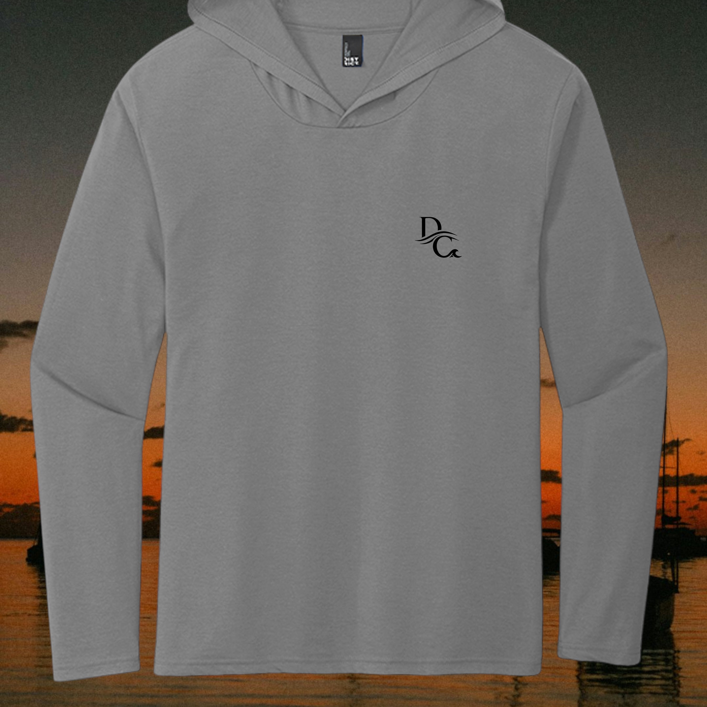 Deepwater Crew Co. grey tri-blend long sleeve hoodie with a small black logo on the chest against a sunset background.