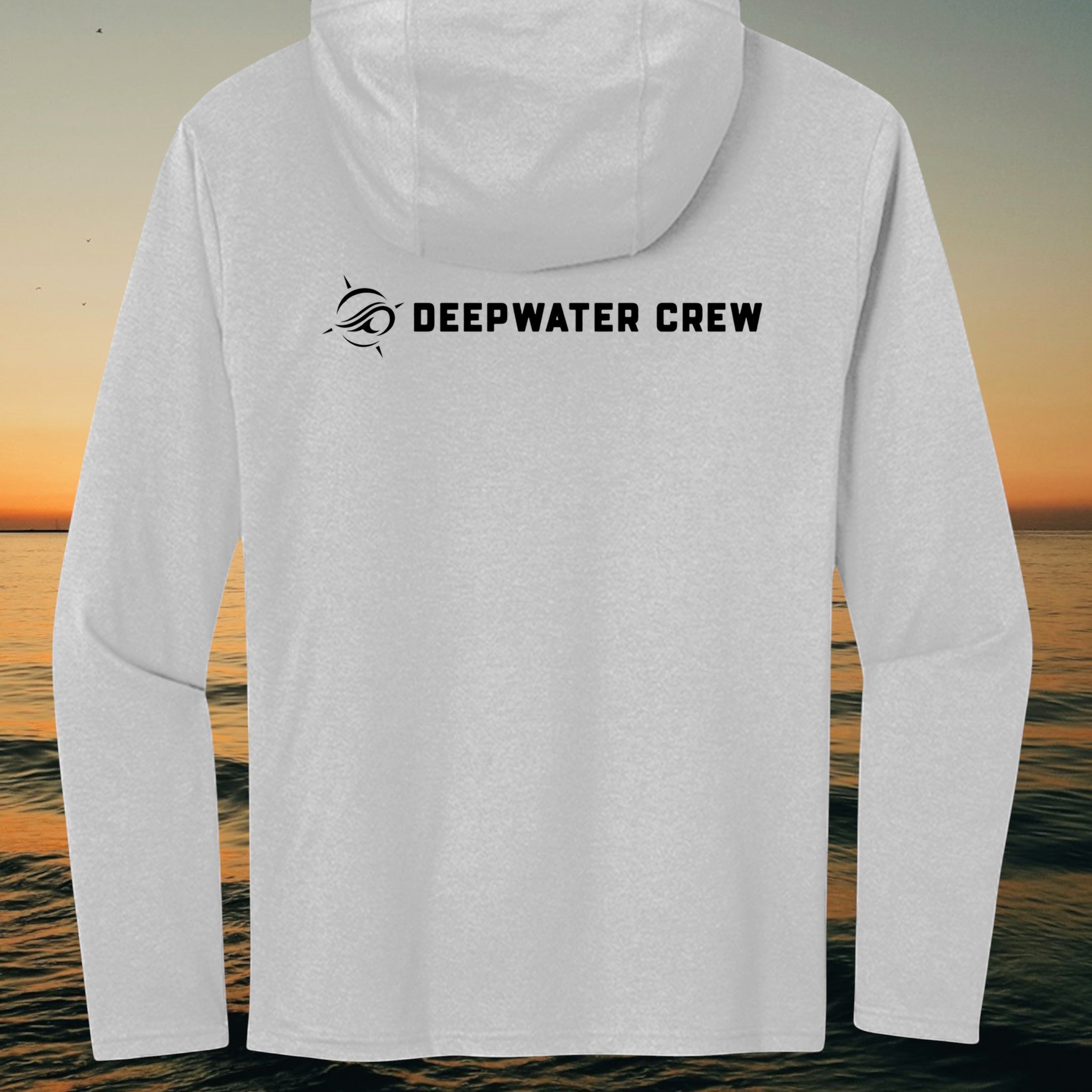 Deepwater Crew Co. light grey long sleeve tri-blend hoodie with black logo on the back against a sunset ocean view.