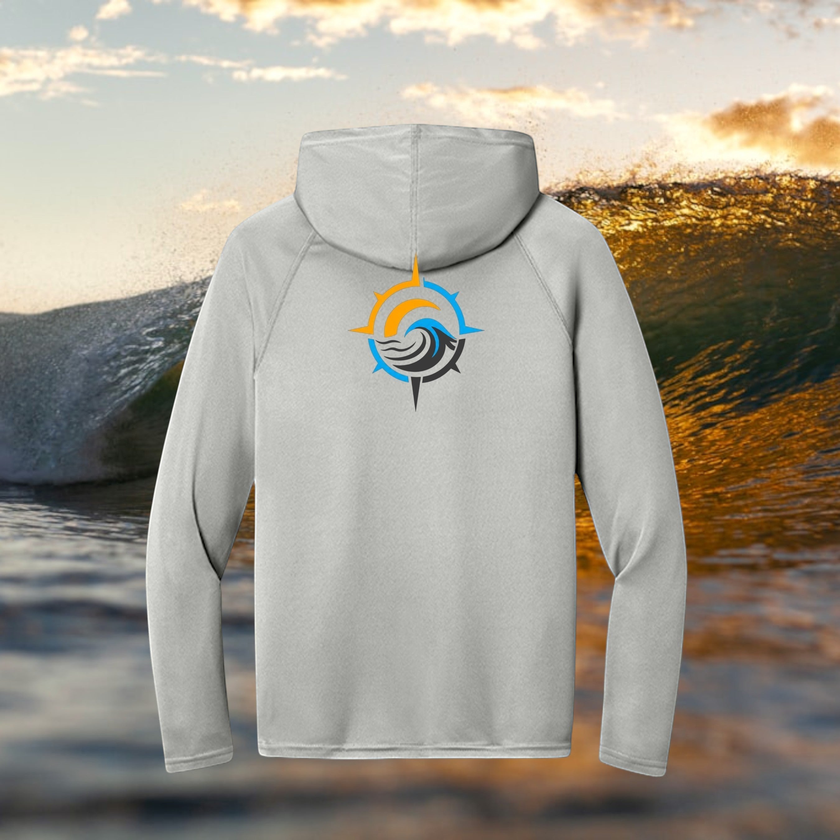 Deepwater Crew Co. light grey performance UPF hoodie with a compass wave logo on the back against an ocean wave