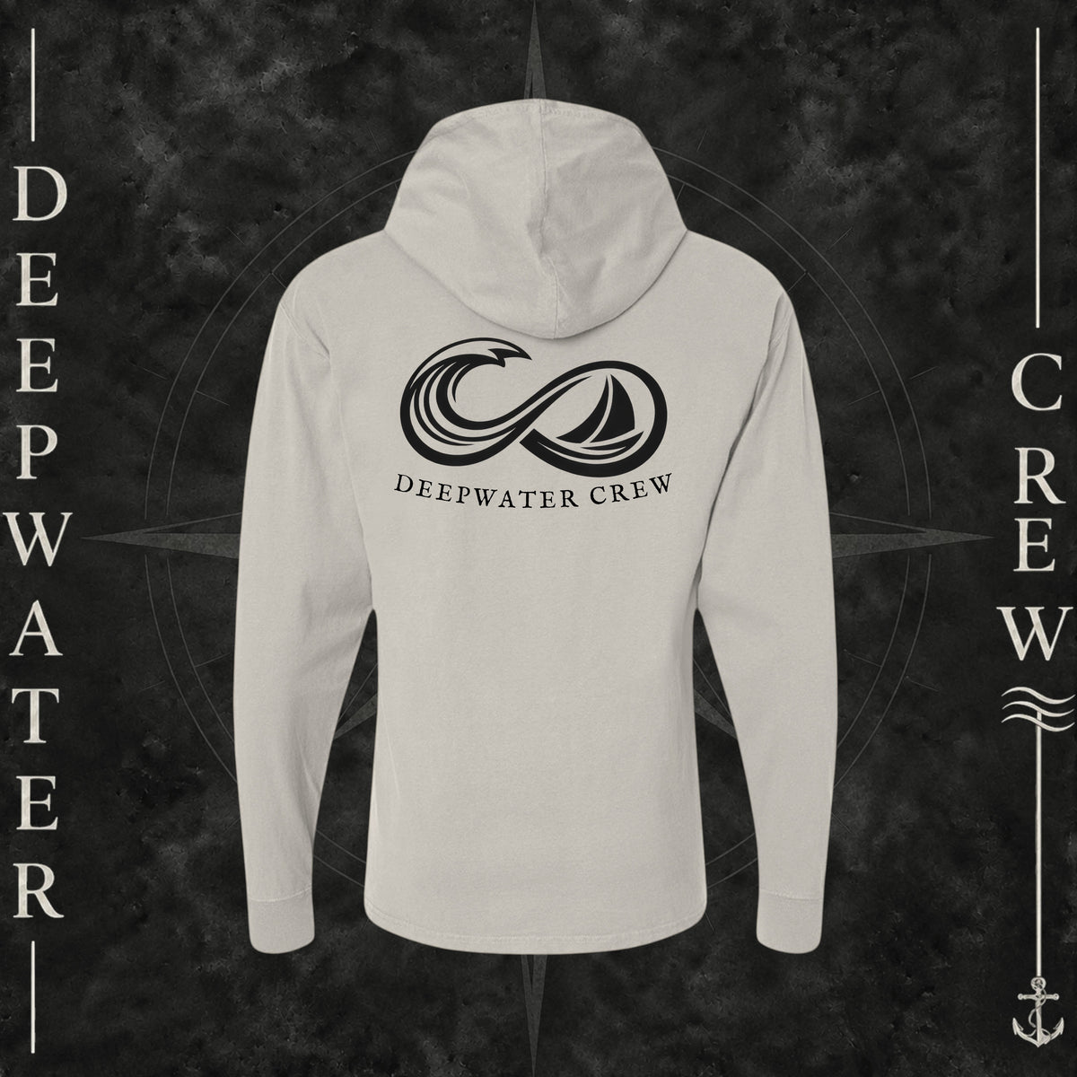 Parchment Deepwater Crew Co. Keep Sailing cotton hooded long-sleeve T-shirt, back view with large infinity-style ocean wave and sailboat graphic above Deepwater Crew lettering.