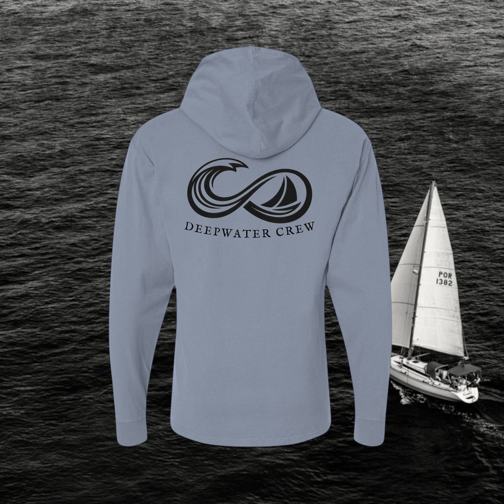 Saltwater Deepwater Crew Co. Keep Sailing cotton hooded long-sleeve T-shirt, back view with large infinity-style ocean wave and sailboat graphic above Deepwater Crew lettering.