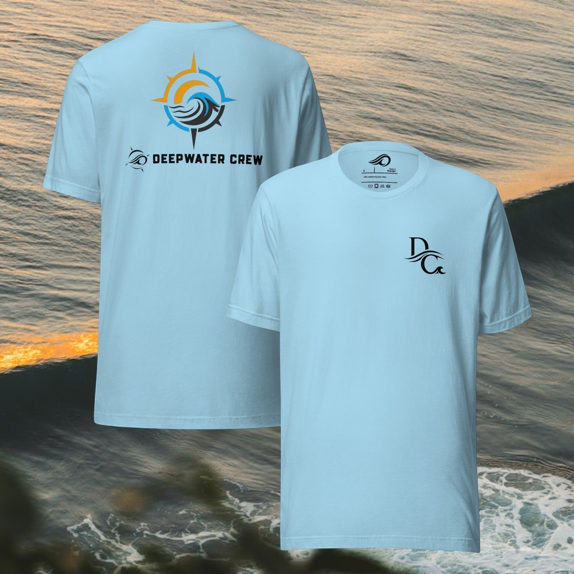 Light blue 100% cotton crew neck t-shirt by Deepwater Crew Co. with a small DC logo on the chest and a large compass wave graphic on the back.