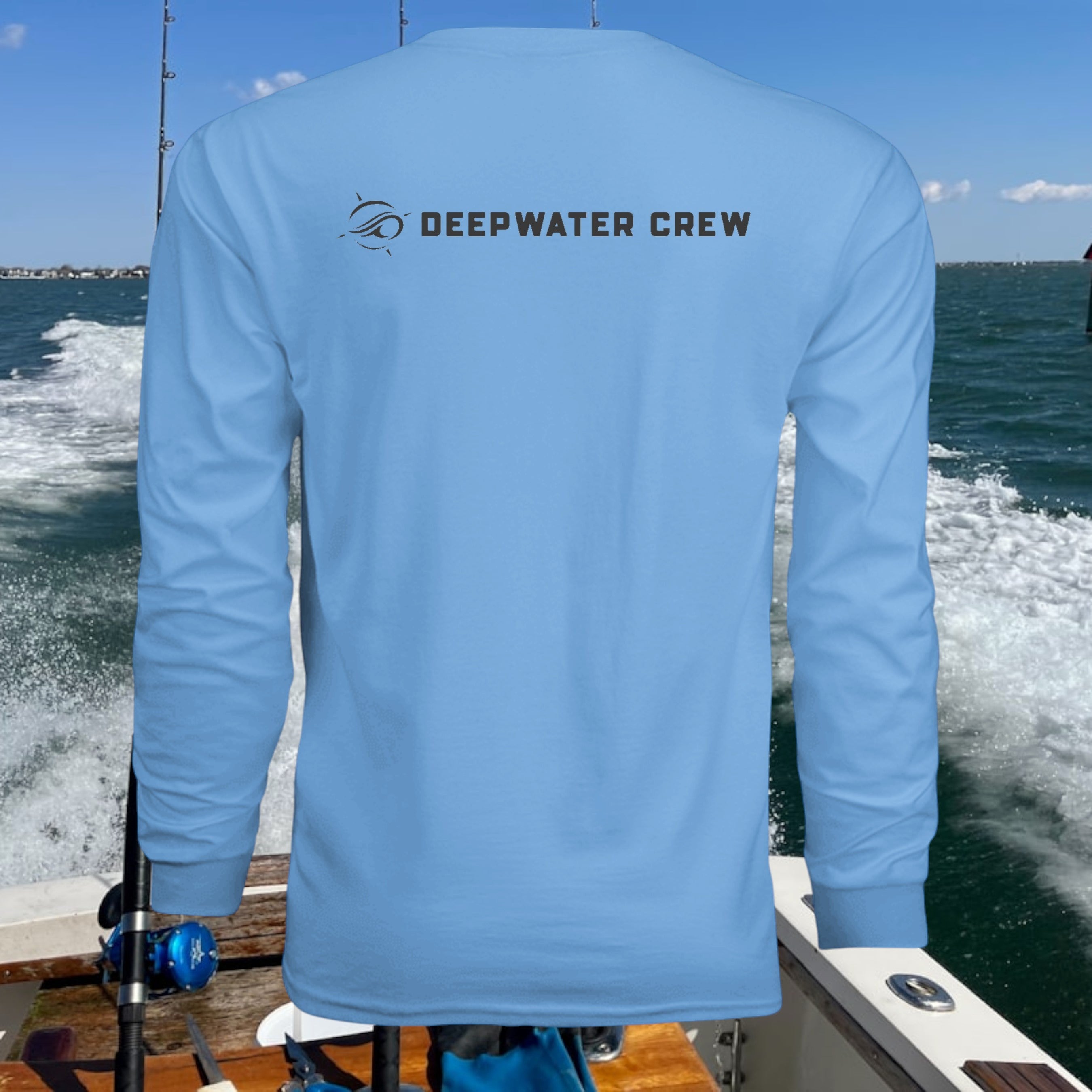 Deepwater Crew Co. light blue long-sleeve polyester performance tee with UPF sun protection.
