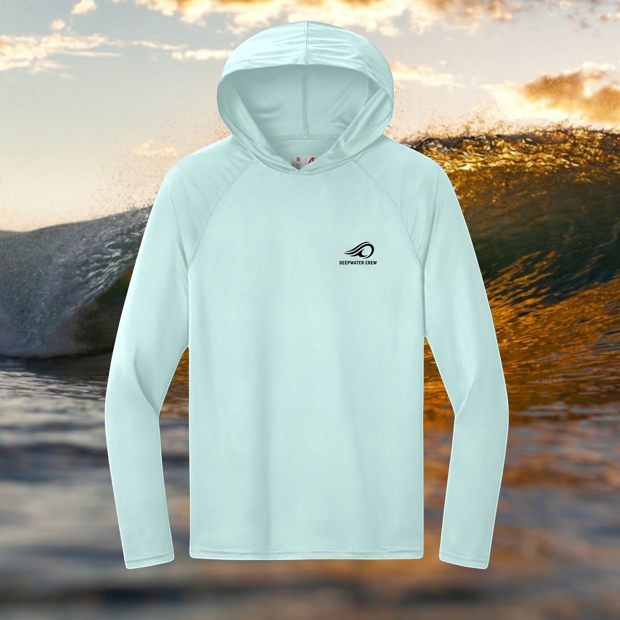 Deepwater Crew Co. light blue performance UPF hoodie with raglan sleeves and logo on chest against an ocean wave.