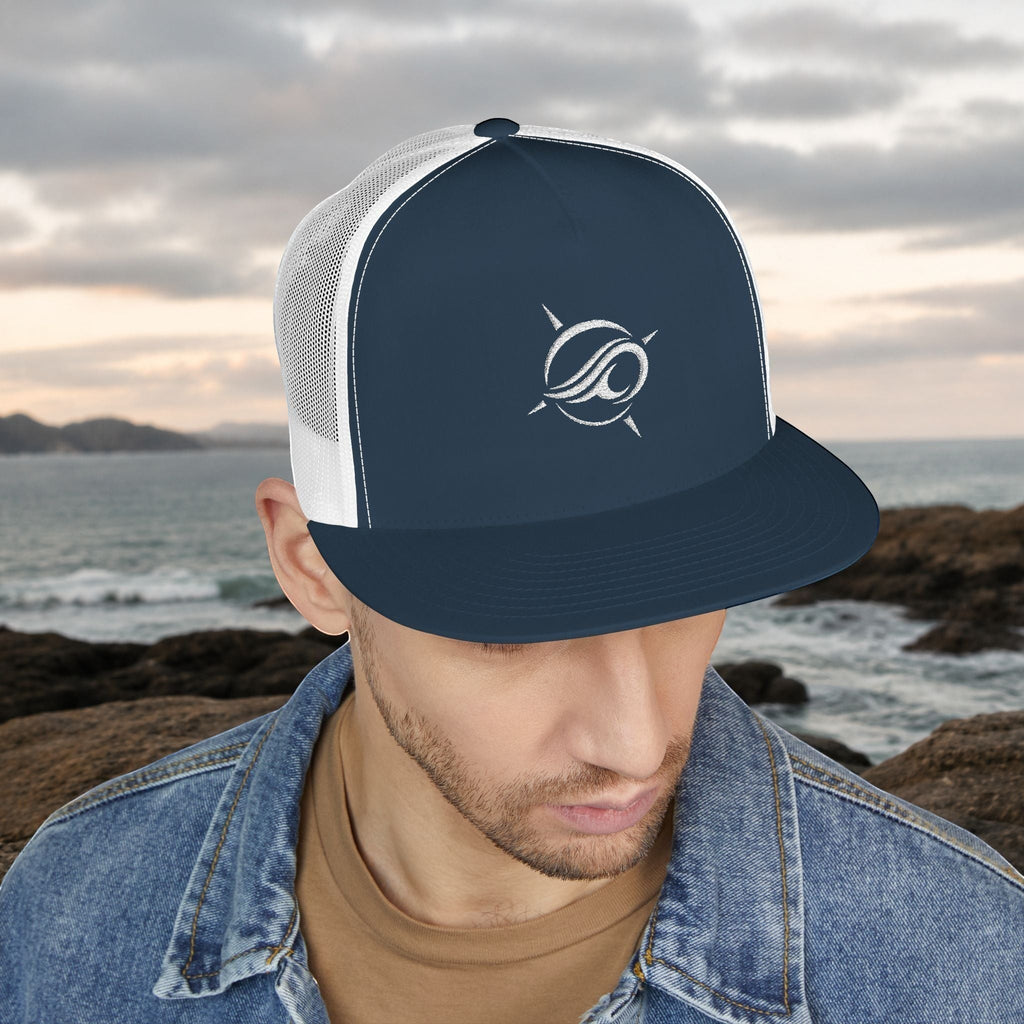 Deepwater Crew Co. navy blue trucker cap with white mesh back and embroidered wave compass logo. Flat bill.
