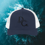 Deepwater Crew Co. navy blue trucker hat with white mesh back and embroidered DC wave logo.