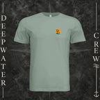 Sage Deepwater Crew Co. Salt Runs Deep crewneck T-shirt, front view with small tropical DC sunset-and-wave crest logo.