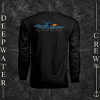 Black Deepwater Crew Co. Salt Runs Deep UPF 44+ long-sleeve performance shirt, back view with shaka hand, ocean waves, distant mountains, orange sunset, seabirds, and “Salt Runs Deep” lettering.