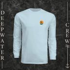 Pastel Blue Deepwater Crew Co. Salt Runs Deep UPF 44+ long-sleeve performance shirt, front view with small tropical DC sunset-and-wave crest logo.