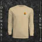 Sand Deepwater Crew Co. Salt Runs Deep UPF 44+ long-sleeve performance shirt, front view with small tropical DC sunset-and-wave crest logo.