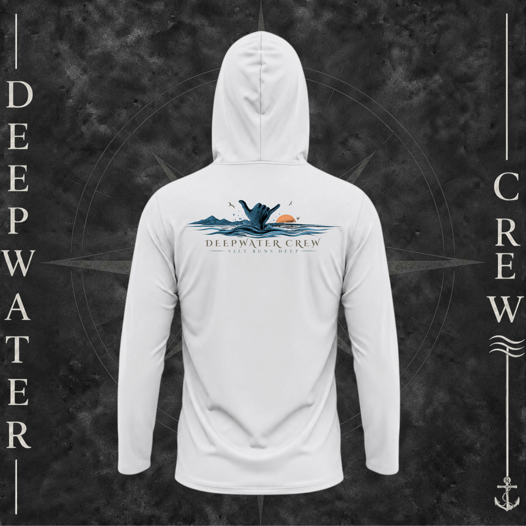 Aluminum Deepwater Crew Co. Salt Runs Deep UPF 50+ performance hoodie, back view with shaka hand, ocean waves, distant mountains, orange sunset, seabirds, and “Salt Runs Deep” lettering.