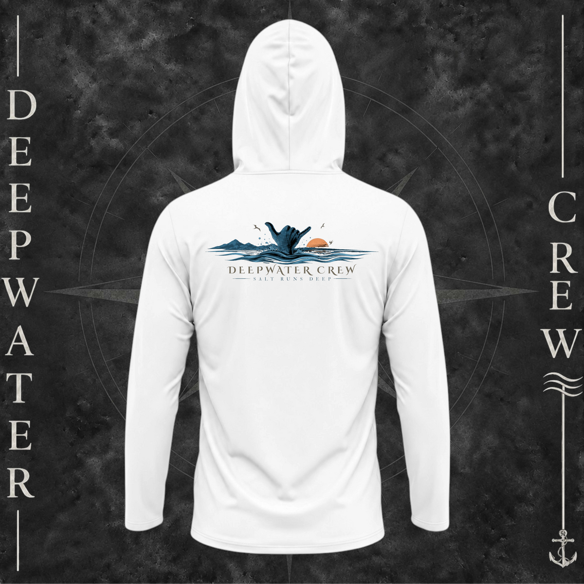 White Deepwater Crew Co. Salt Runs Deep UPF 50+ performance hoodie, back view with shaka hand, ocean waves, distant mountains, orange sunset, seabirds, and “Salt Runs Deep” lettering.