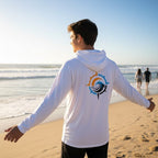 Deepwater Crew Co. white performance UPF hoodie with a compass logo on the back, worn by a man on a sunny beach.